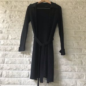 Women’s long black belted sweater.